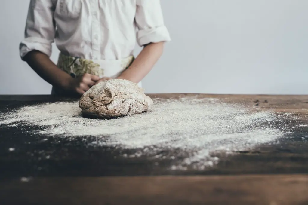 dog eats raw bread dough